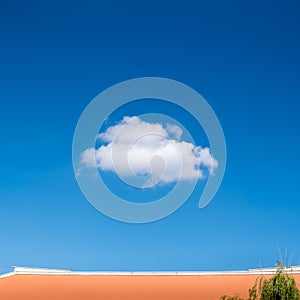 Single tiny cloud on blue sky.