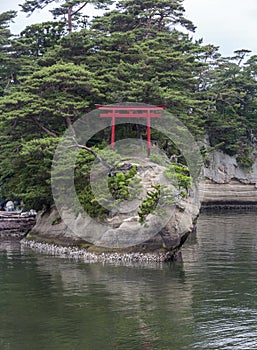 A single torii gate on an island in Matsushima, Japan.