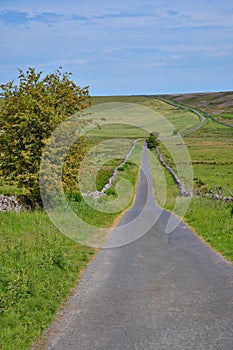 Single track country road, leading to Skelton Moor. Yorkshire Dales, England.