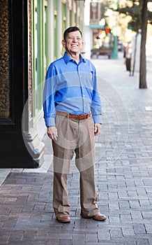 Single transgender man standing outside