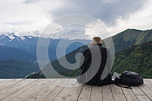 Single traveler watching on mountains landscape, By Mestia, Georgia