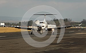 Single turboprop aircraft, airplane taking off photo