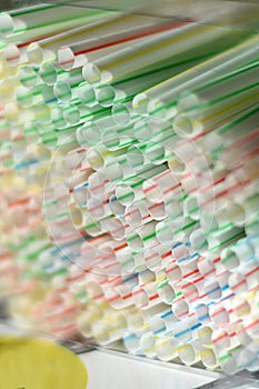 Single use disposable throwaway white striped plastic straws