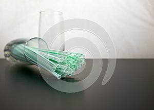 single use plastic against reusable steel straw.
