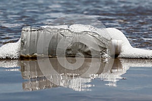 Plastic bottle washed up at beach