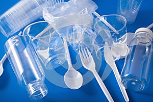 Single use plastic bottles, cups, forks, spoons. concept of recycling plastic, plastic waste