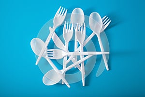 Single use plastic forks, spoons. concept of recycling plastic, plastic waste