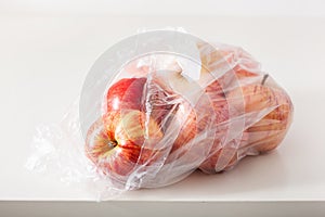 Single use plastic packaging issue. apples in plastic bag