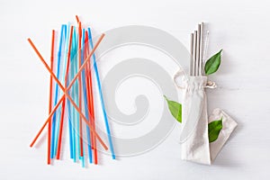 Single use plastic and reusable metal eco-friendly drinking straw. zero waste concept