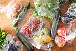 Single use plastic waste issue. fruits and vegetables in plastic bags