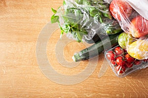 Single use plastic waste issue. fruits and vegetables in plastic bags