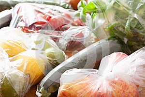 Single use plastic waste issue. fruits and vegetables in plastic bags