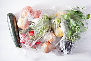 Single use plastic waste issue. fruits and vegetables in plastic bags