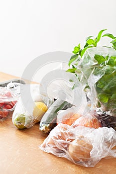 Single use plastic waste issue. fruits and vegetables in plastic bags