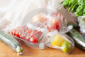 Single use plastic waste issue. fruits and vegetables in plastic bags