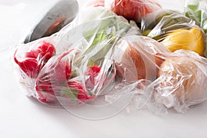 single use plastic waste issue. fruits and vegetables in plastic bags