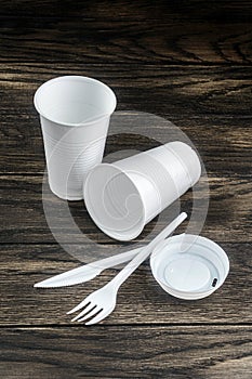 Single-use white plastic items on table