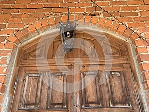 Single vintage lantern hanging over the door