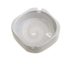 Single white ashtray is empty.