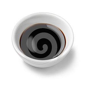 Single white bowl with Balsamic vinegar, aceto balsamico, on white background close up