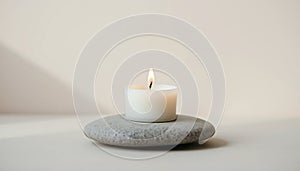 Single White Candle on Gray Stone photo