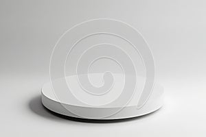 a single white circular platform with a smooth, matte finish