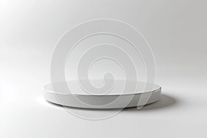A single white circular platform with a smooth, matte finish