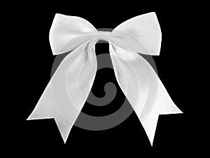 single white ribbon bow isolated on black background