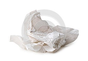 Single white screwed or crumpled tissue paper or napkin in strange shape after use in toilet or restroom isolated on white