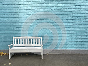 Single white wooden bench on a background of blue brick wall. The facade of the building painted in blue. Vintage photo with copy