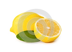 Single whole fresh beautiful yellow lemons with half and leaves isolated on white background with clipping path