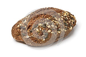Single whole sourdough loaf of bread with a variation of seeds close up on white background