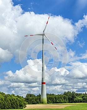 Single wind turbine in the field in rural area in Bavaria