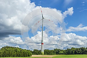 Single wind turbine in the field in rural area in Bavaria