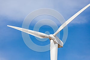 Single Wind Turbine Over Dramatic Blue Sky