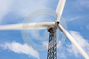 Single Wind Turbine Over Dramatic Blue Sky