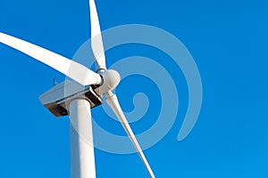 Single Wind Turbine Over Dramatic Blue Sky