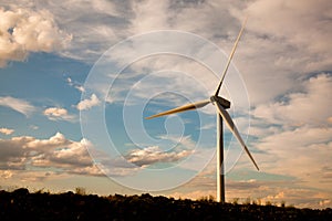 Single wind turbine at sunset