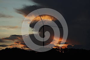 Single Wind Turbines under Storm Cloud Sunset