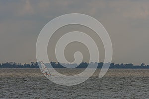 Single windsurfer at the lake