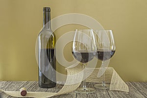 Single wine bottle and two glasses