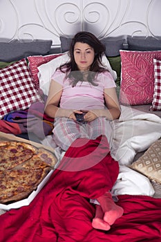 Single woman eating pizza