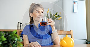 Single woman enjoys tea alone, peaceful solitude. Cinematic single life scene, tranquility in solitude, content alone