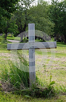 Single wood cross in a cemetery