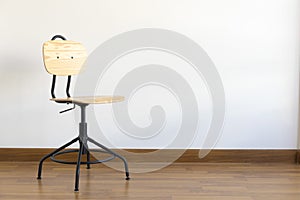 Single  wood stool on wooden floor