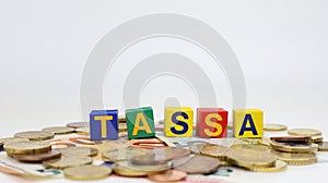 Single word TASSA on wooden block taxes  photo