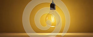 Single yellow bulb hangs against vibrant yellow backdrop , yellow bulb, retro