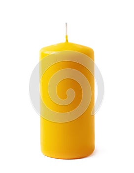 Single yellow wax candle isolated