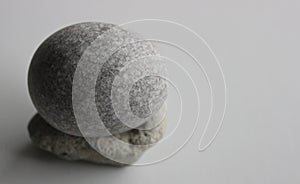 Single Zen Stone On White Surface At A Side Of Image Stock Photo For Backgrounds