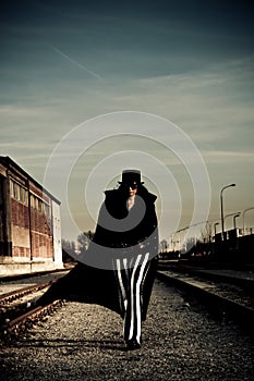 Sinister Figure Near Railroad Tracks